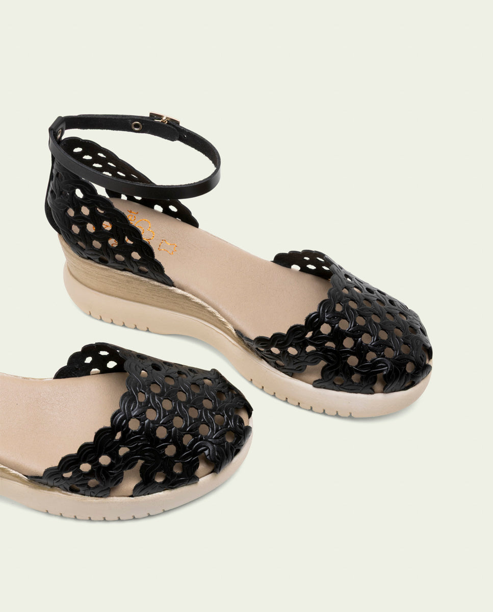 SANDALES À TALONS COMPENSÉS EN CUIR TRESSÉ EVA NOIR